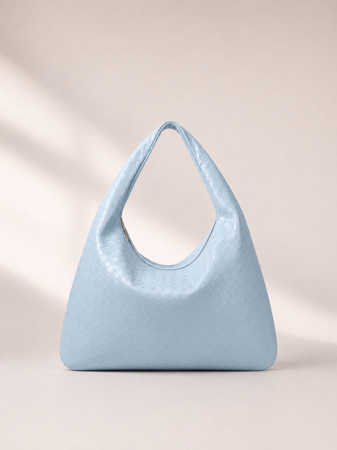 Sac à main porté épaule effet tressé